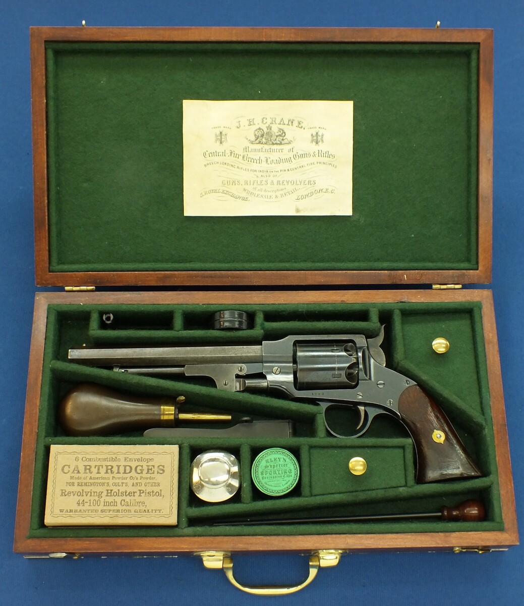 A Vintage Walnut case refitted and relined green interior made to fit Rogers & Spencer Single Action Army Revolver. 39x22x6cm. In very good condition. Price 350 euro.