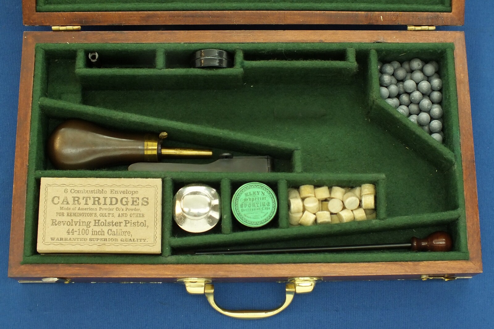 A Vintage Walnut case refitted and relined green interior made to fit Rogers & Spencer Single Action Army Revolver. 39x22x6cm. In very good condition. Price 350 euro.