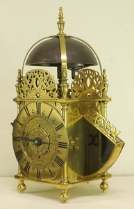 An antique 17th century English winged brass lantern clock, signed Richard Ames near St Andrews Church in Holborne Fecit, total height 39.5cm. 