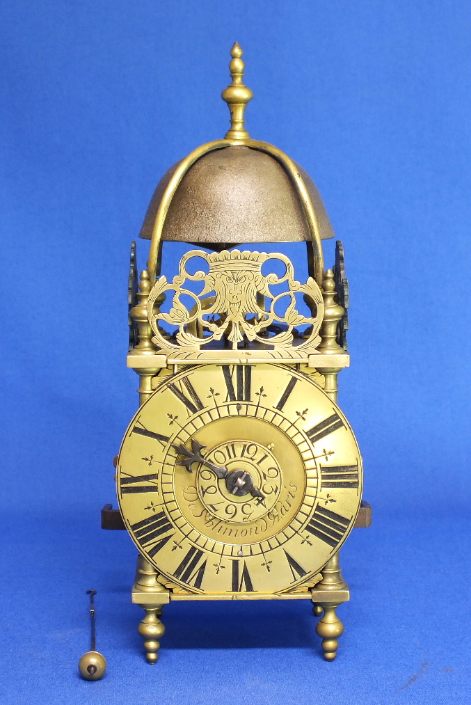 An Antique 18th century miniature French Lantern clock by De Saint Blimond a Paris. Height 26 cm. Price 5.000 euro