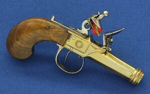 An antique 19th century Belgian Brass Box-lock Flintlock pocket pistol with thumbpiece safety catch. Caliber 10mm, length 13,5cm. In very good condition. Price 595 euro
