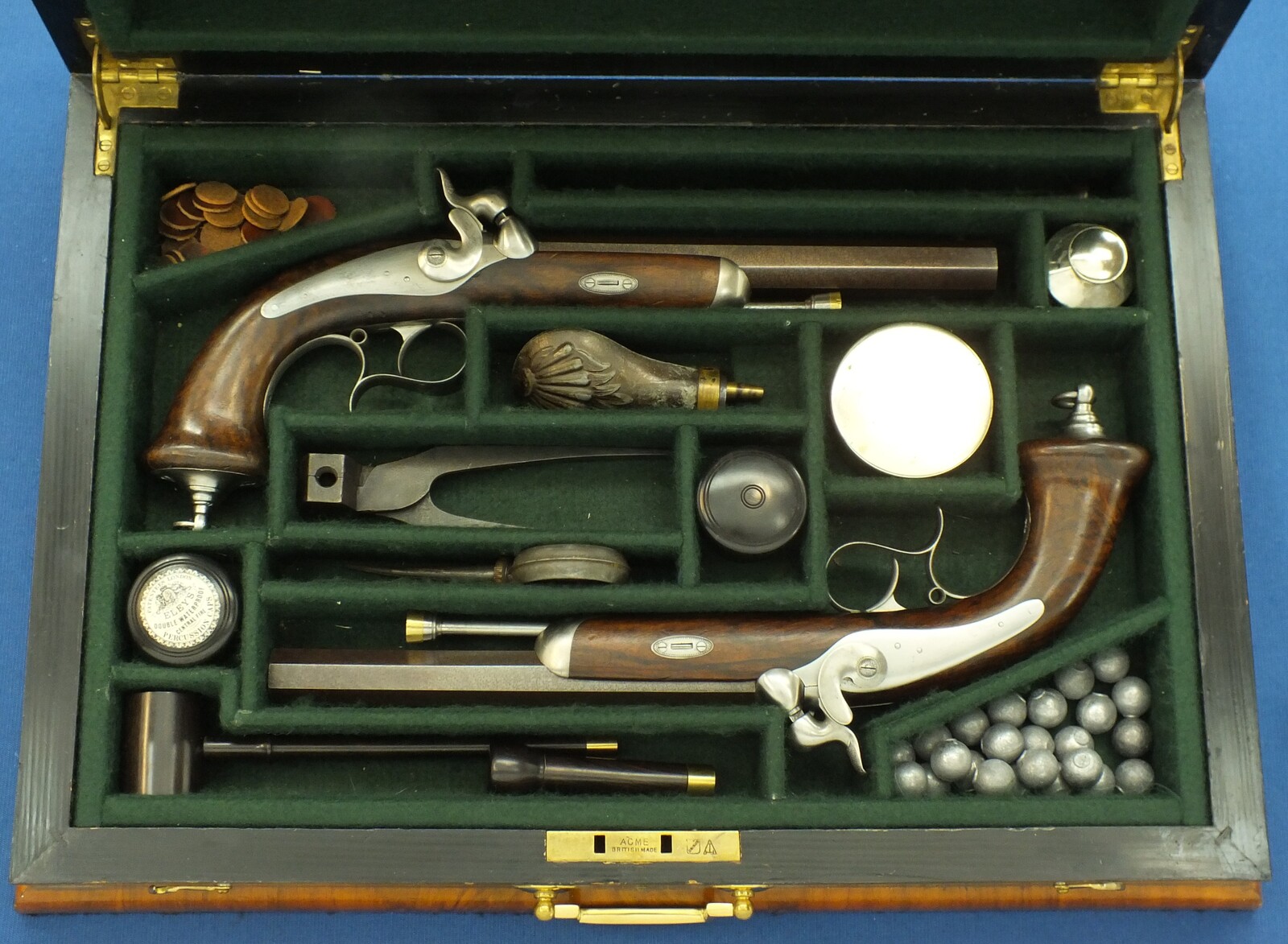 An antique 19th century circa 1860 pair of French Percussion pistols by Perrin Paris in vintage/antique Walnut veneered case with refitted and relined green interior. Caliber 17mm. Length 39cm. In very good condition. Price 2.750 euro.