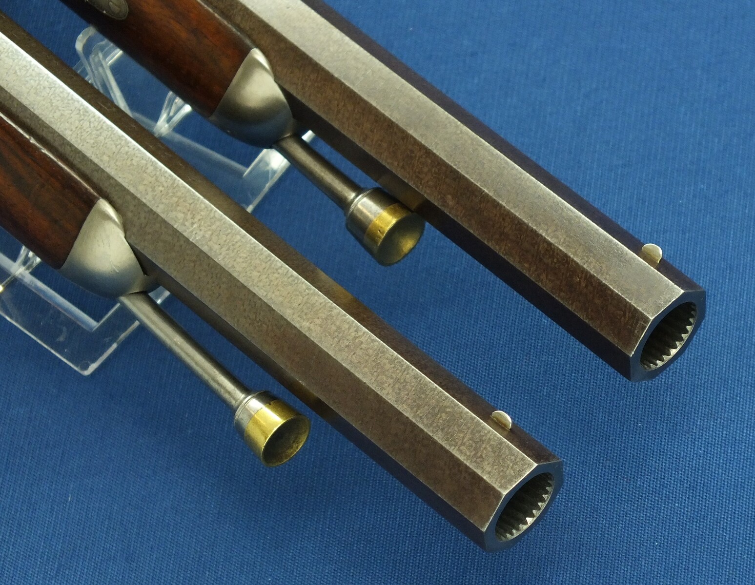 An antique 19th century circa 1860 pair of French Percussion pistols by Perrin Paris in vintage/antique Walnut veneered case with refitted and relined green interior. Caliber 17mm. Length 39cm. In very good condition. Price 2.750 euro.