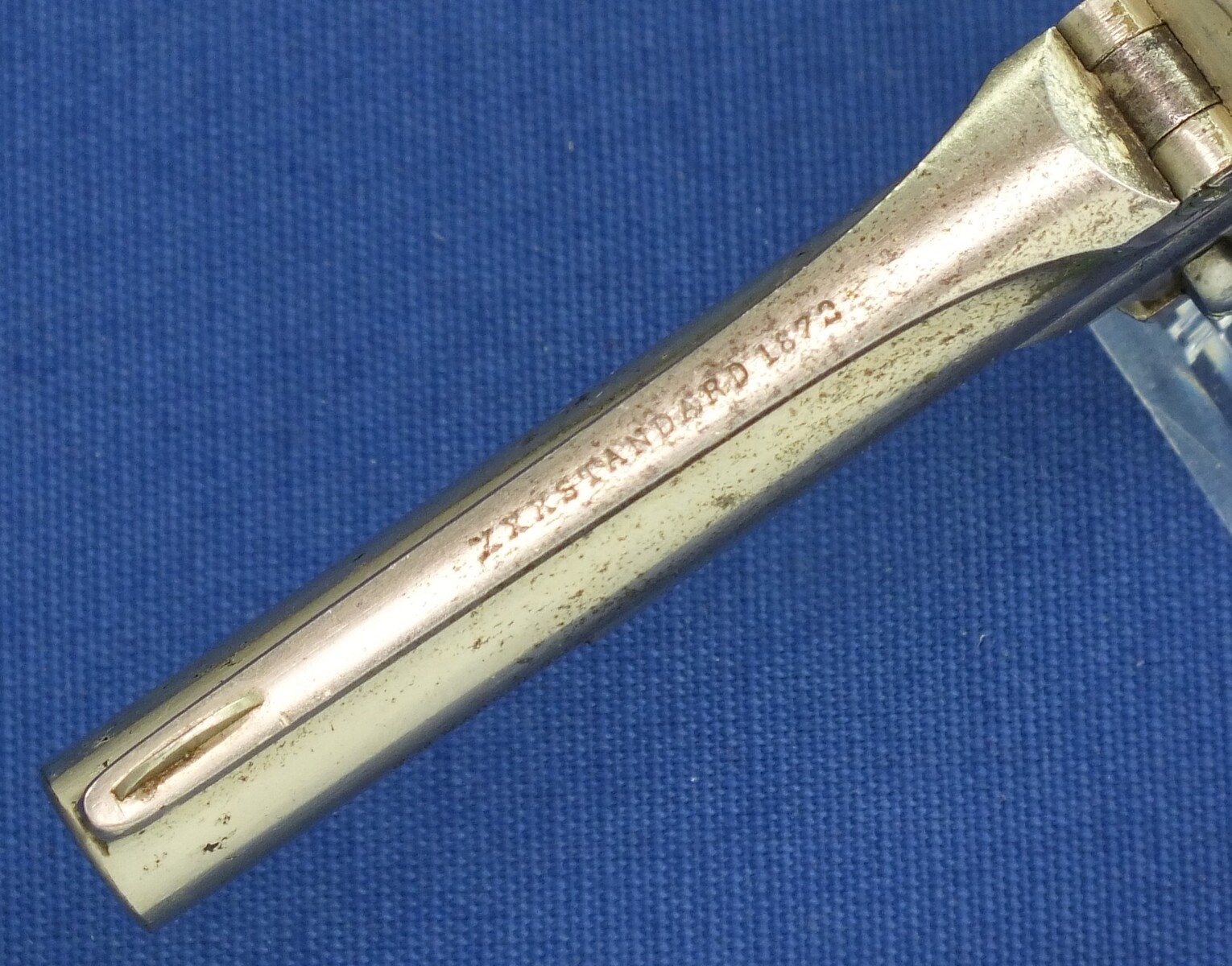 An antique American Nickel plated Marlin XXX Standard 1872 5 shot 30 Rimfire pocket Revolver. Fluted cylinder. Hard Rubber grips. Lenght 19 cm. In very good condition. Price 675 euro