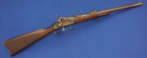 An antique American US Springfield Model 1884 Trapdoor Carbine. 22 inch barrel. Caliber 45-70. Length 105cm. In very good condition. Price 1.950 euro.