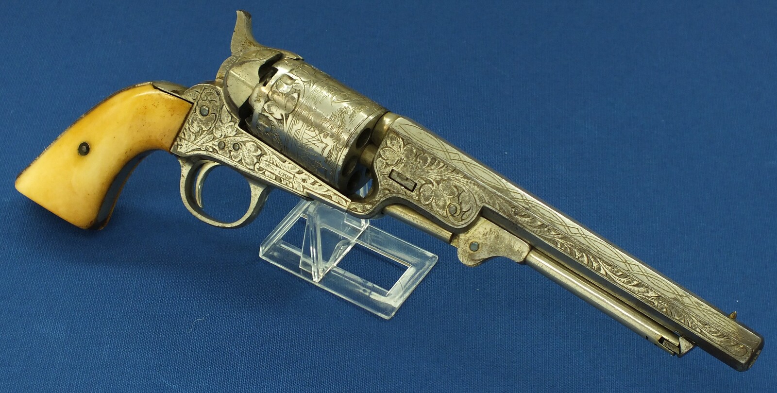 An antique Belgian Brevete engraved and Nickel Plated Colt Model 1851 Navy 6 shot Percussion Revolver by Jean-Baptiste Rongé & Fils. Caliber 35, 7 inch barrel. Length 34,5cm. In very good condition. Price 1.750 euro.