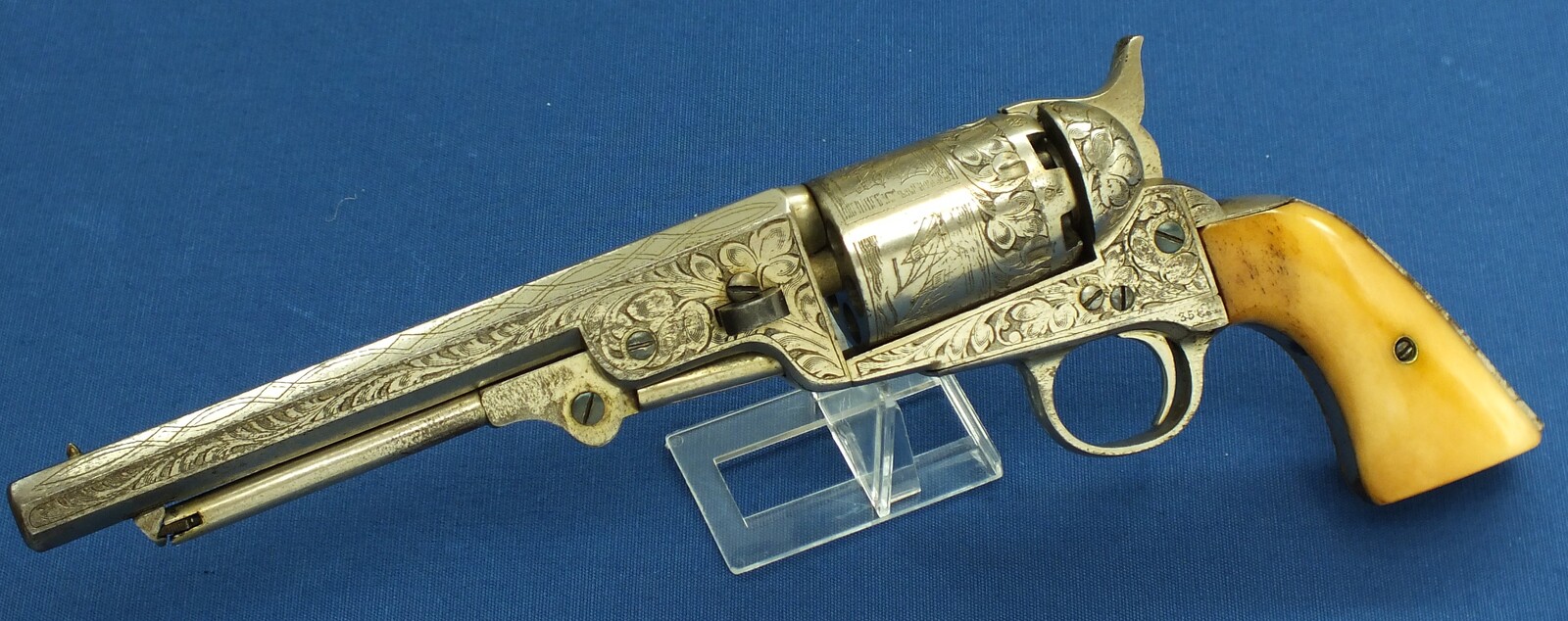 An antique Belgian Brevete engraved and Nickel Plated Colt Model 1851 Navy 6 shot Percussion Revolver by Jean-Baptiste Rongé & Fils. Caliber 35, 7 inch barrel. Length 34,5cm. In very good condition. Price 1.750 euro.