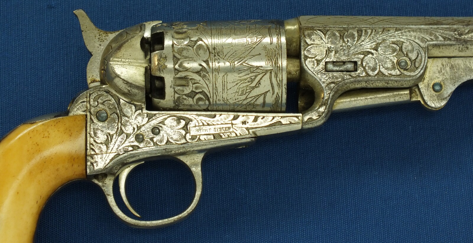 An antique Belgian Brevete engraved and Nickel Plated Colt Model 1851 Navy 6 shot Percussion Revolver by Jean-Baptiste Rongé & Fils. Caliber 35, 7 inch barrel. Length 34,5cm. In very good condition. Price 1.750 euro.
