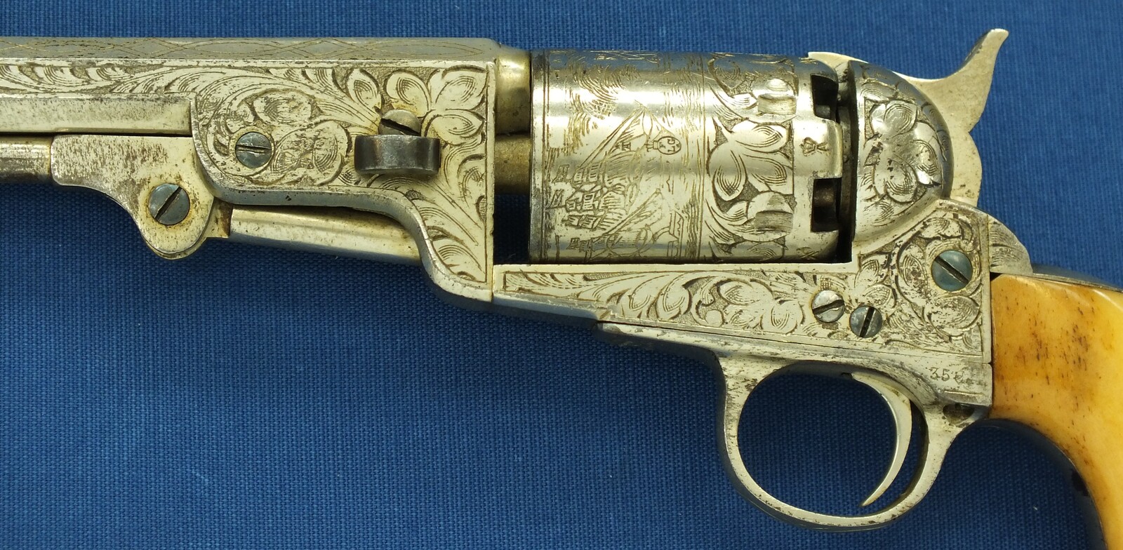 An antique Belgian Brevete engraved and Nickel Plated Colt Model 1851 Navy 6 shot Percussion Revolver by Jean-Baptiste Rongé & Fils. Caliber 35, 7 inch barrel. Length 34,5cm. In very good condition. Price 1.750 euro.