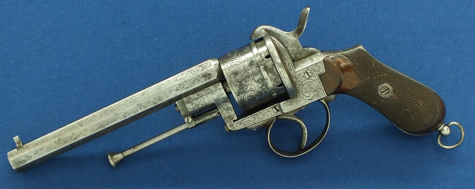 An antique Belgian/Liege engraved Lefaucheux type 6 shot single and Double-Action 12mm pinfire Revolver with rare swing out ejector Rod fixed in frame. Length 31,5cm. In good/very good condition. Price 750 euro