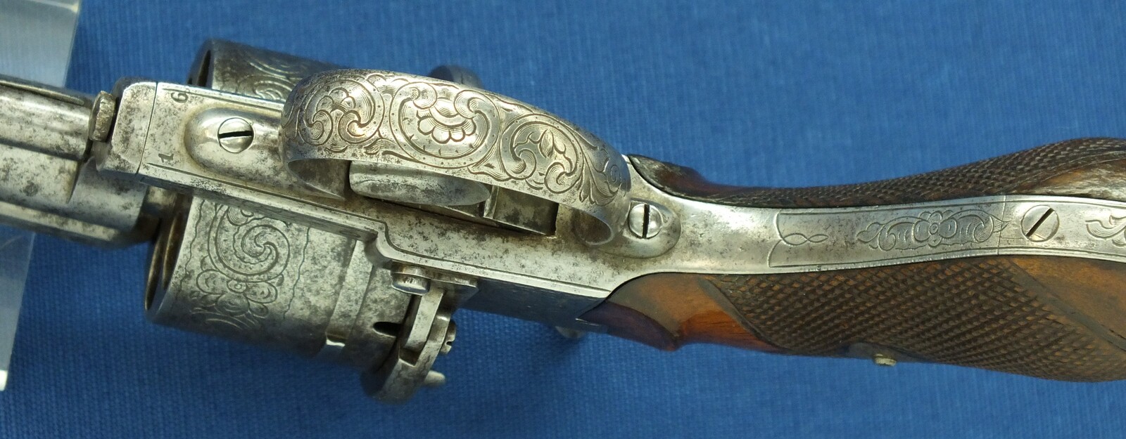 An antique Belgian/Liege engraved Lefaucheux type 6 shot single and Double-Action 12mm pinfire Revolver with rare swing out ejector Rod fixed in frame. Length 31,5cm. In good/very good condition. Price 750 euro
