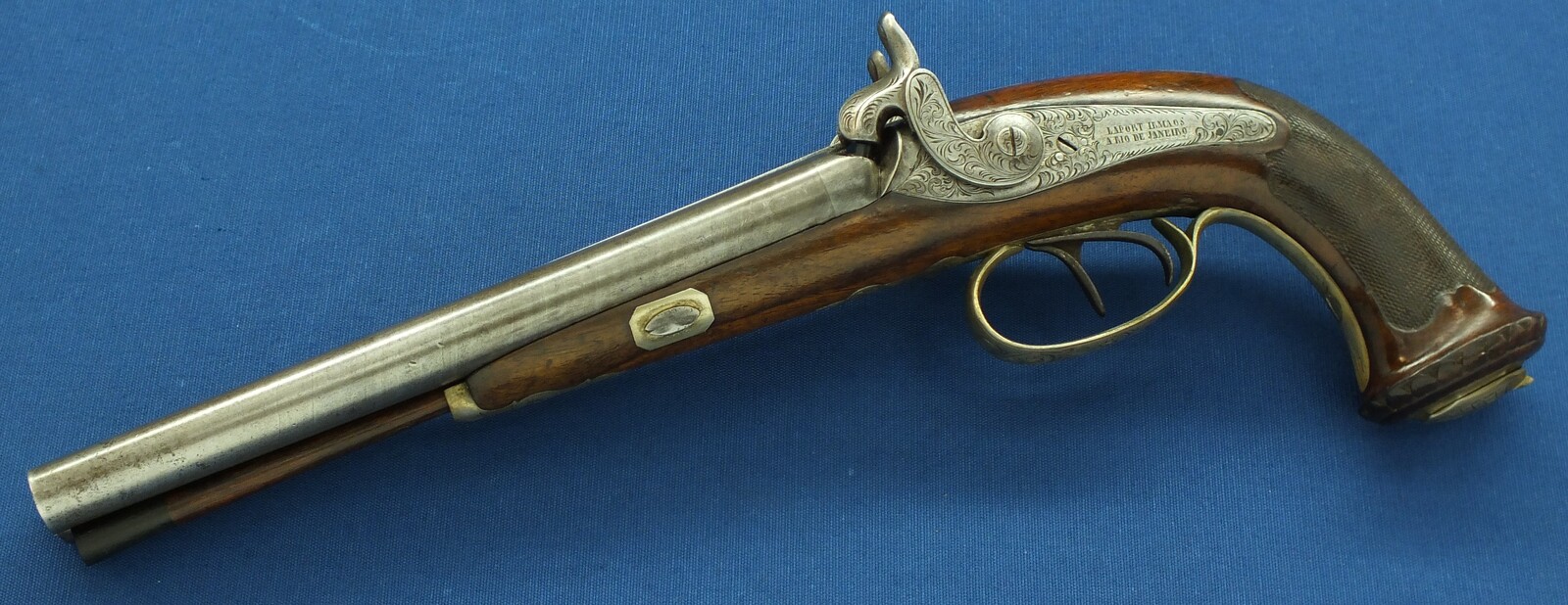 An antique Brazilian/Belgian Double Barreled Percussion Pistol by Laport Irmaos(Laport Freres) A Rio de Janeiro. Caliber 14mm smooth. 8,5 inch Damast barrels. Length 395,cm. In very good condition. Price 1.350 euro.