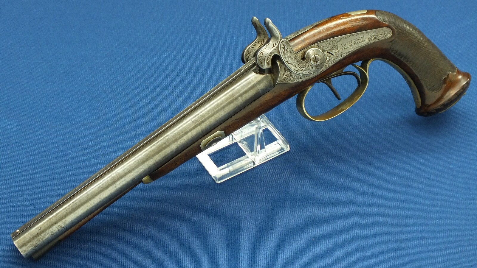 An antique Brazilian/Belgian Double Barreled Percussion Pistol by Laport Irmaos(Laport Freres) A Rio de Janeiro. Caliber 14mm smooth. 8,5 inch Damast barrels. Length 395,cm. In very good condition. Price 1.350 euro.