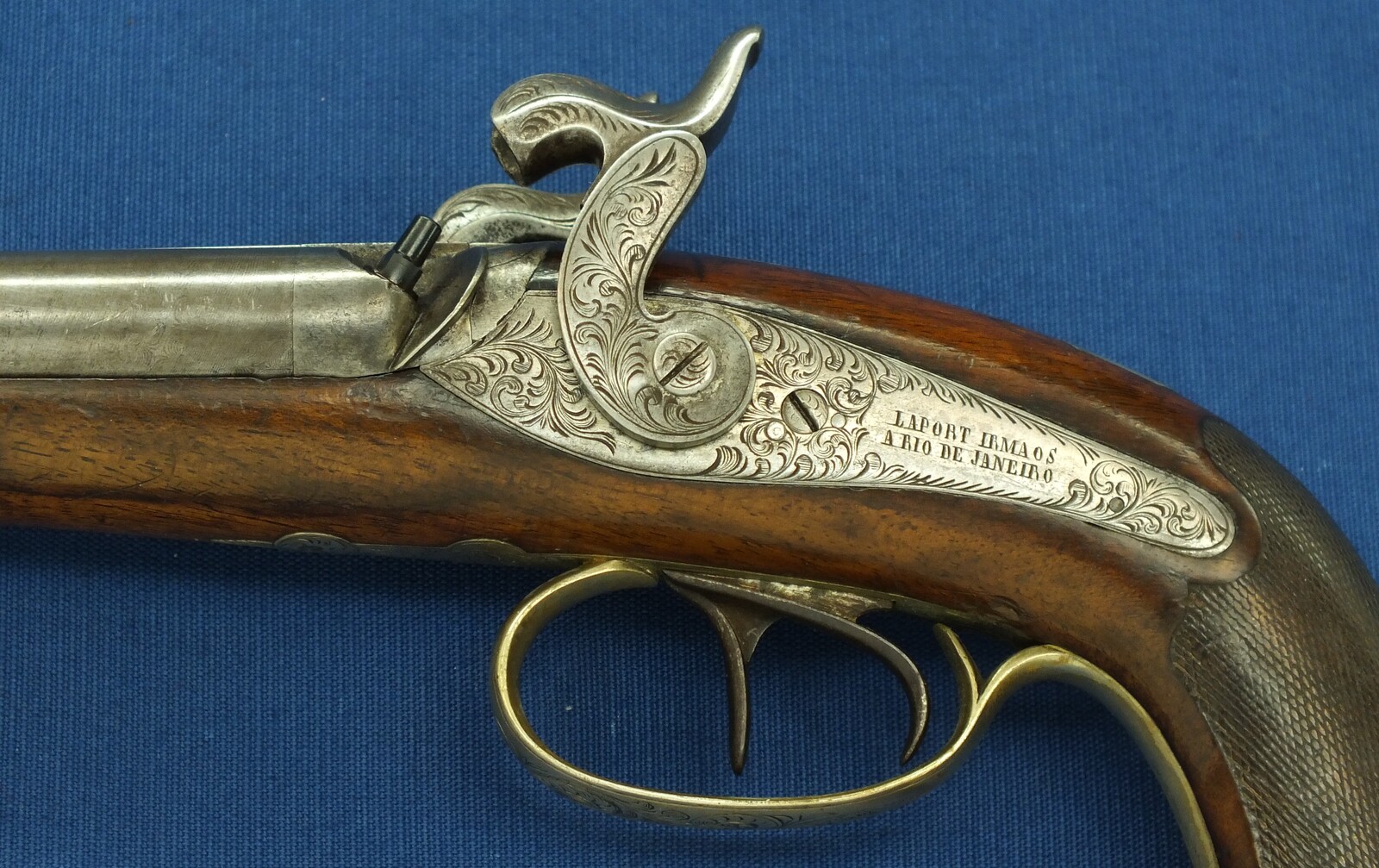 An antique Brazilian/Belgian Double Barreled Percussion Pistol by Laport Irmaos(Laport Freres) A Rio de Janeiro. Caliber 14mm smooth. 8,5 inch Damast barrels. Length 395,cm. In very good condition. Price 1.350 euro.