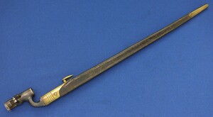 An antique British pattern 1876 socket bayonet modified in Egypt for 303 Martini-Enfield Rifle. Length 65cm. In very good condition. 