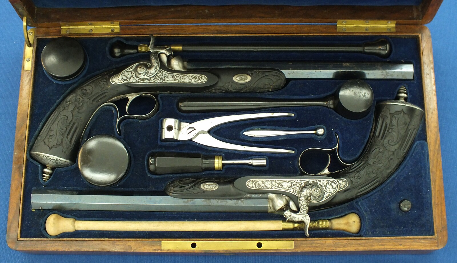 An antique cased French pair of Percussion pistols by Firmin Paris, successor of Alphonse Caron circa 1860. 12mm Caliber, length 43cm. In very good condition. Price on request.