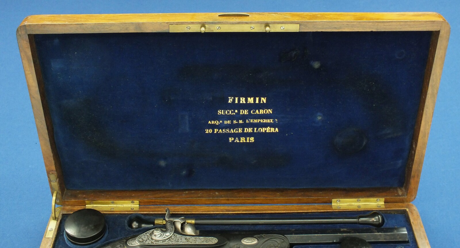 An antique cased French pair of Percussion pistols by Firmin Paris, successor of Alphonse Caron circa 1860. 12mm Caliber, length 43cm. In very good condition. Price on request.