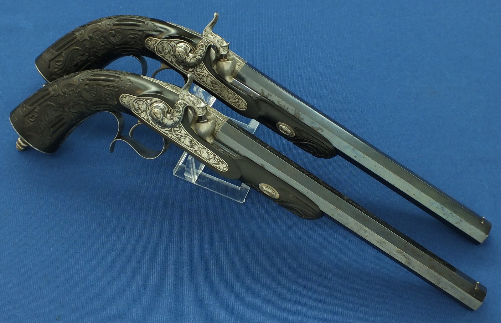 An antique cased French pair of Percussion pistols by Firmin Paris, successor of Alphonse Caron circa 1860. 12mm Caliber, length 43cm. In very good condition. Price on request.