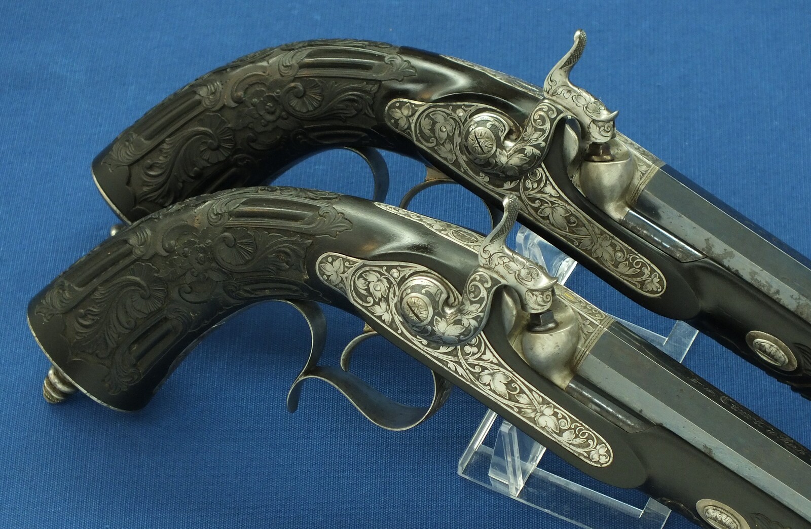 An antique cased French pair of Percussion pistols by Firmin Paris, successor of Alphonse Caron circa 1860. 12mm Caliber, length 43cm. In very good condition. Price on request.
