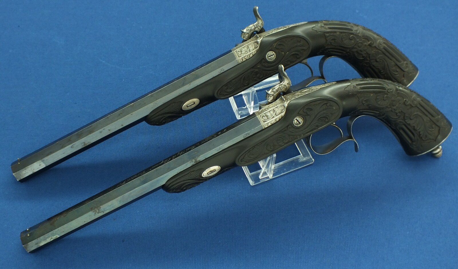 An antique cased French pair of Percussion pistols by Firmin Paris, successor of Alphonse Caron circa 1860. 12mm Caliber, length 43cm. In very good condition. Price on request.