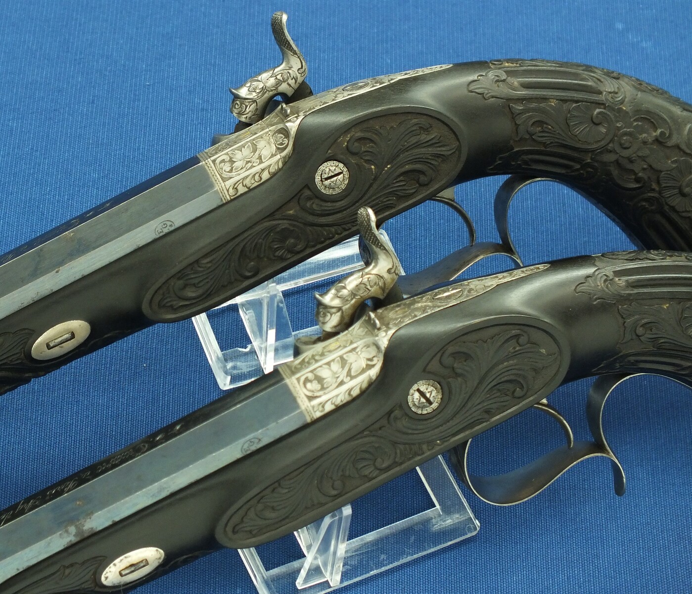 An antique cased French pair of Percussion pistols by Firmin Paris, successor of Alphonse Caron circa 1860. 12mm Caliber, length 43cm. In very good condition. Price on request.