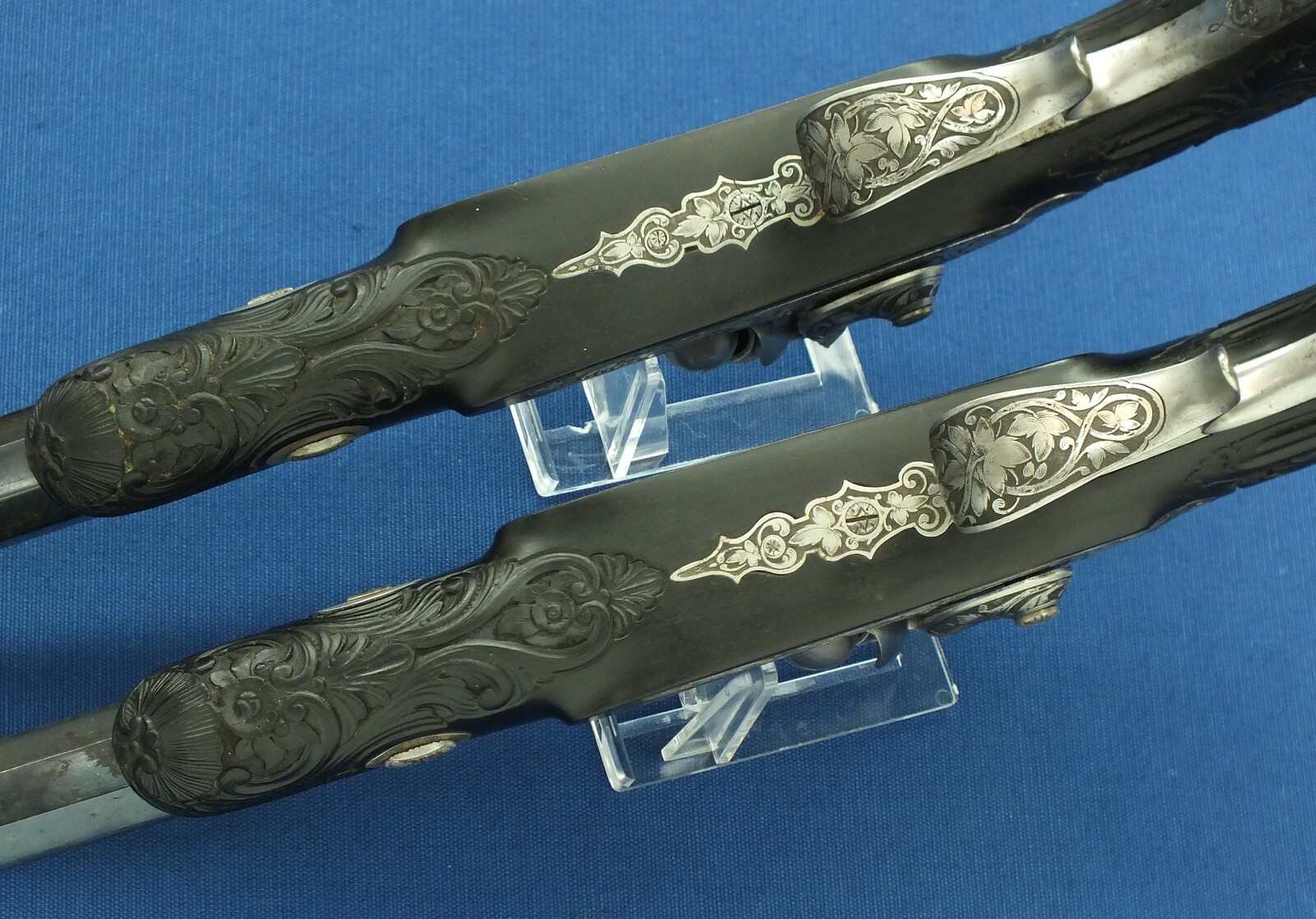 An antique cased French pair of Percussion pistols by Firmin Paris, successor of Alphonse Caron circa 1860. 12mm Caliber, length 43cm. In very good condition. Price on request.