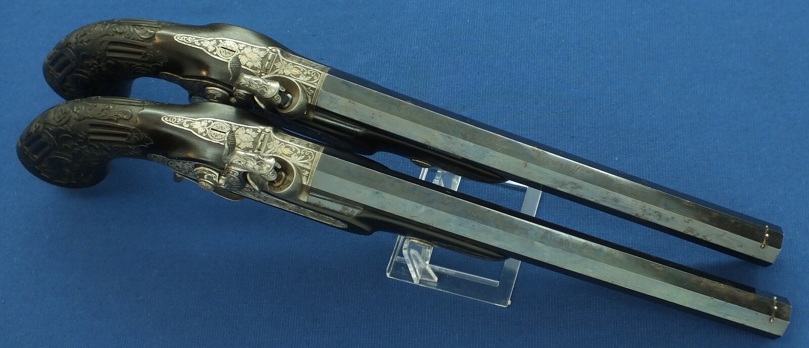 An antique cased French pair of Percussion pistols by Firmin Paris, successor of Alphonse Caron circa 1860. 12mm Caliber, length 43cm. In very good condition. Price on request.