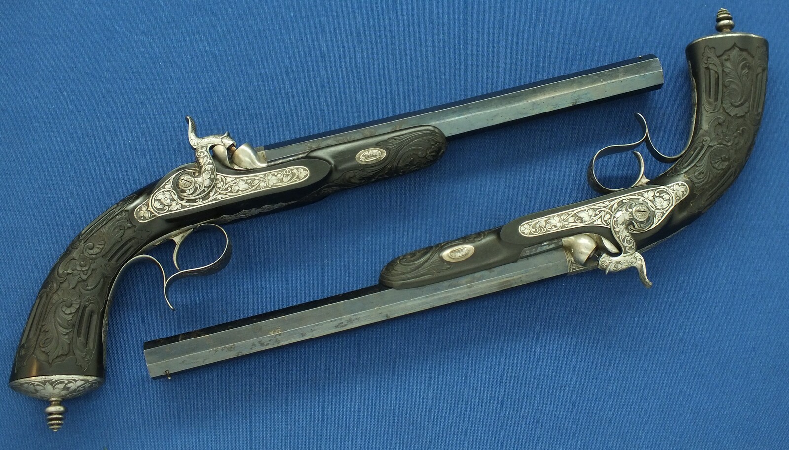 An antique cased French pair of Percussion pistols by Firmin Paris, successor of Alphonse Caron circa 1860. 12mm Caliber, length 43cm. In very good condition. Price on request.