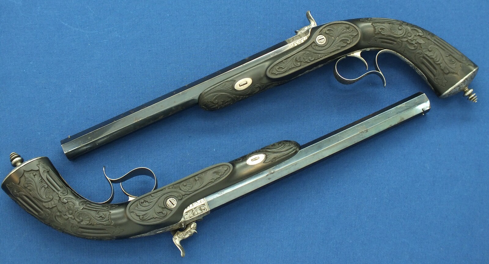 An antique cased French pair of Percussion pistols by Firmin Paris, successor of Alphonse Caron circa 1860. 12mm Caliber, length 43cm. In very good condition. Price on request.