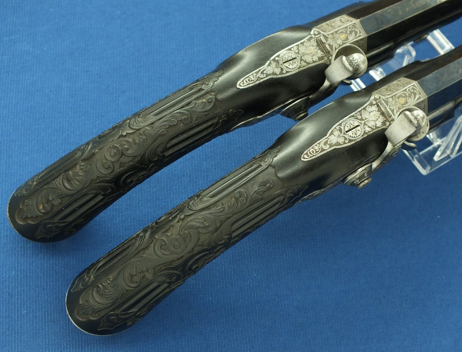 An antique cased French pair of Percussion pistols by Firmin Paris, successor of Alphonse Caron circa 1860. 12mm Caliber, length 43cm. In very good condition. Price on request.