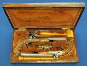 An antique cased pair of Belgian Liege Percussion pistols with Damast barrels. 13mm Caliber, length 34cm. In very good condition. Price 7.500 euro