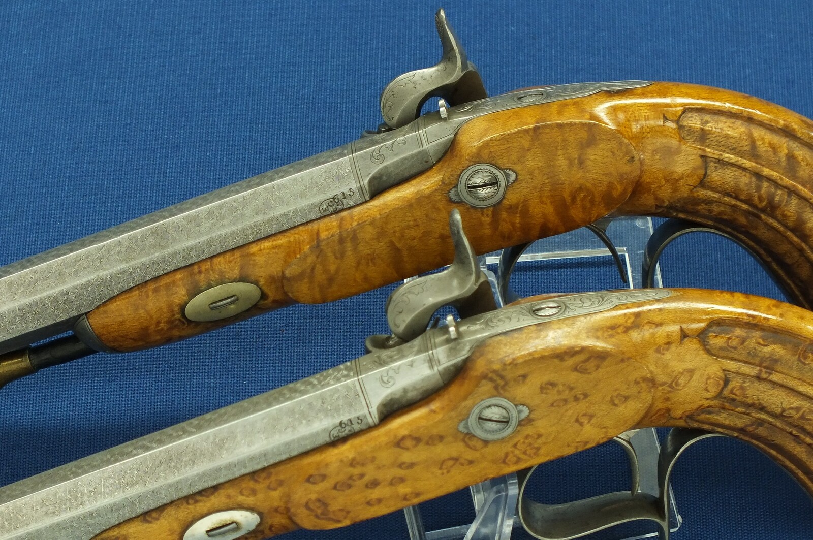 An antique cased pair of Belgian Liege Percussion pistols with Damast barrels. 13mm Caliber, length 34cm. In very good condition. Price 7.500 euro