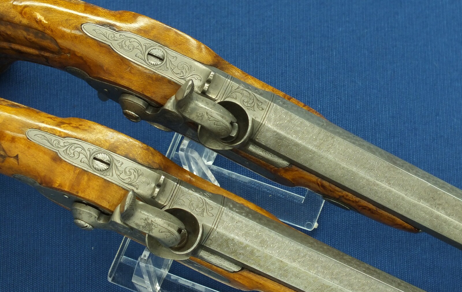 An antique cased pair of Belgian Liege Percussion pistols with Damast barrels. 13mm Caliber, length 34cm. In very good condition. Price 7.500 euro