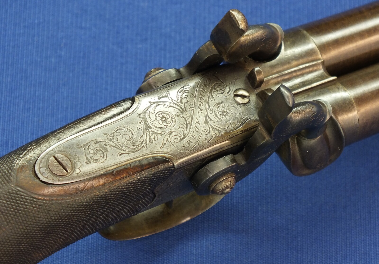 An antique English 19th century circa 1850 Box-Lock percussion double barreled pistol. By George Adams. Caliber 12mm. Length 25,5cm. In very good condition. Price 950 euro.