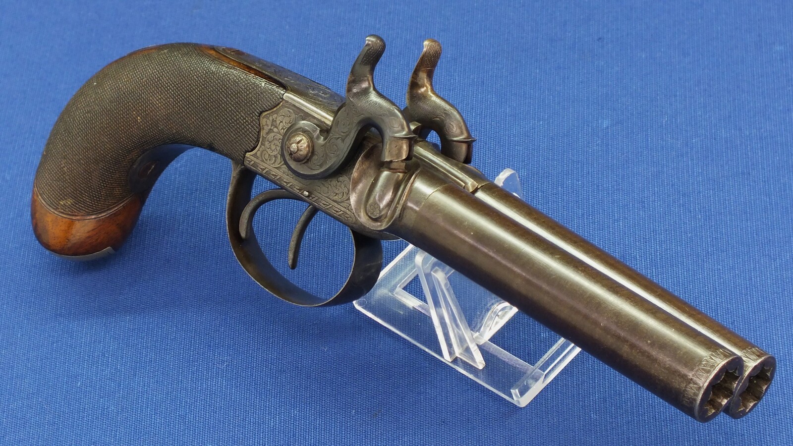 An antique English 19th century circa 1850 Box-Lock percussion double barreled pistol. By George Adams. Caliber 12mm. Length 25,5cm. In very good condition. Price 950 euro.