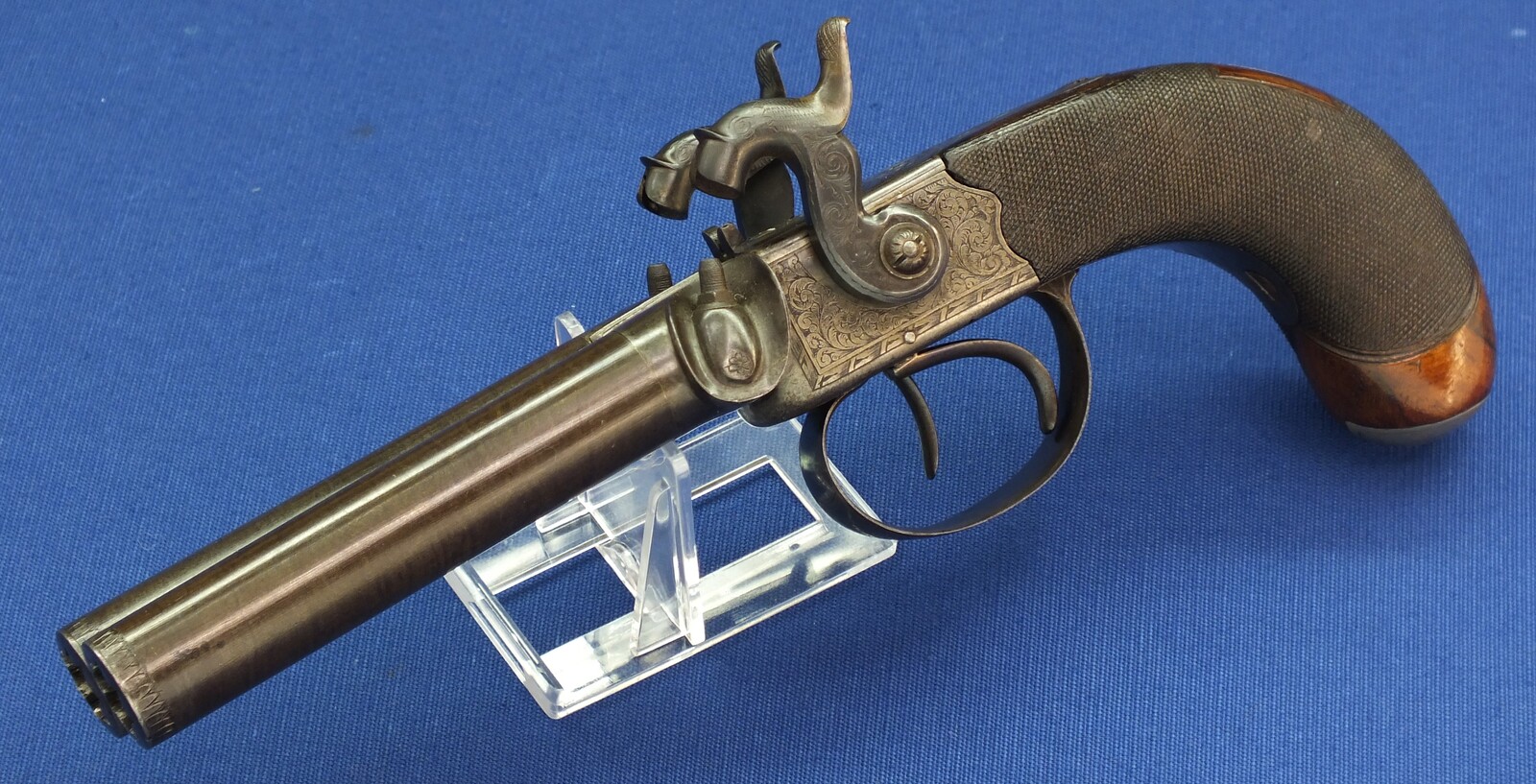 An antique English 19th century circa 1850 Box-Lock percussion double barreled pistol. By George Adams. Caliber 12mm. Length 25,5cm. In very good condition. Price 950 euro.