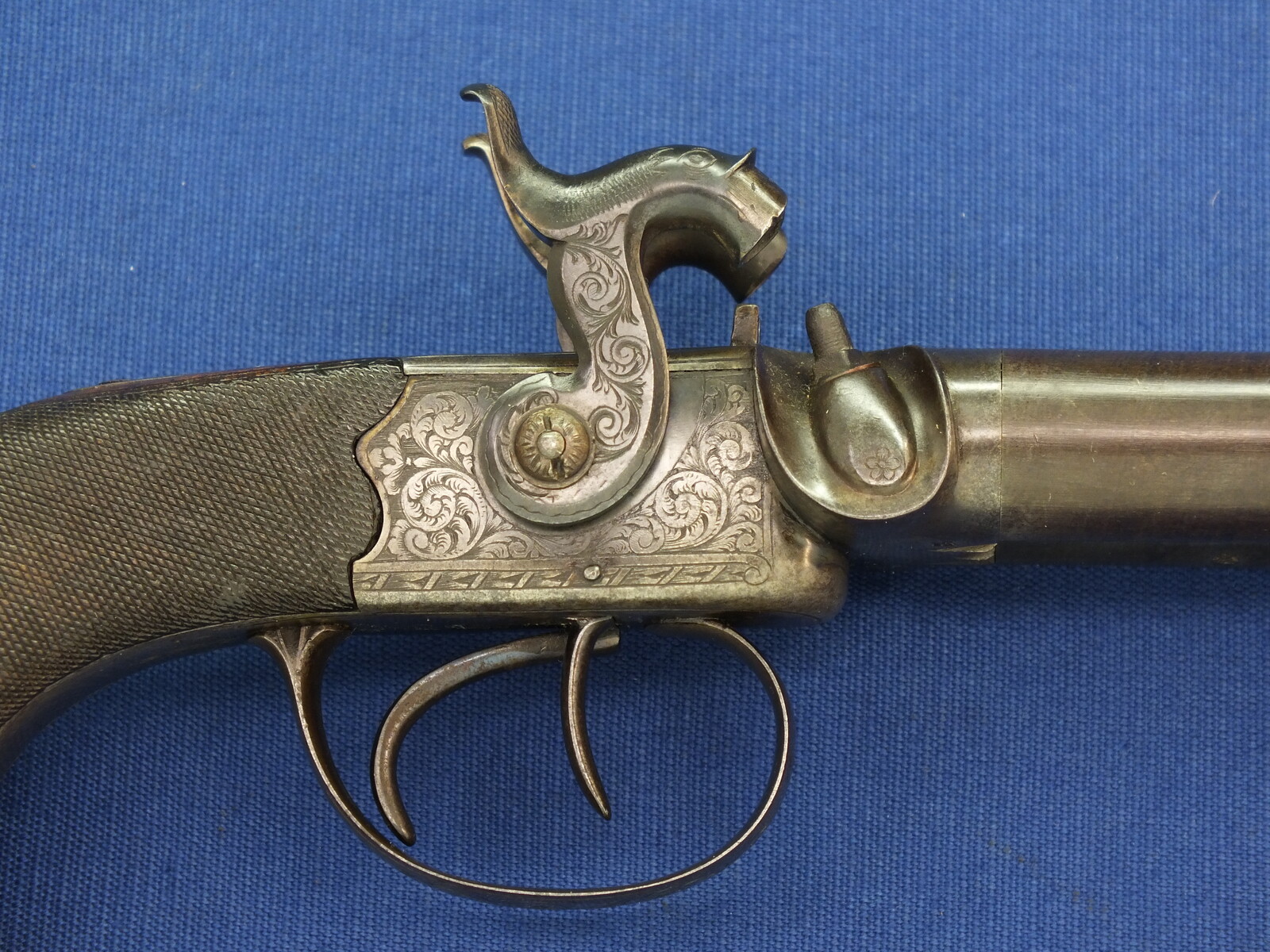 An antique English 19th century circa 1850 Box-Lock percussion double barreled pistol. By George Adams. Caliber 12mm. Length 25,5cm. In very good condition. Price 950 euro.