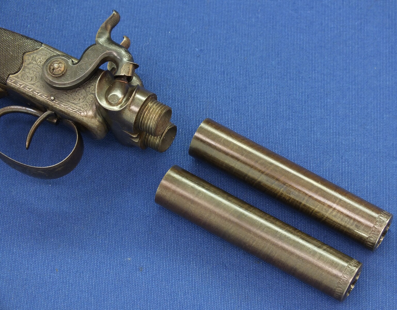 An antique English 19th century circa 1850 Box-Lock percussion double barreled pistol. By George Adams. Caliber 12mm. Length 25,5cm. In very good condition. Price 950 euro.