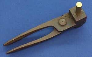 An antique heavy Swiss Minié Bullet Mold. Caliber 10mm. Marked KL for Kanton Luzern. Length 22,5cm. In very good condition. Price 170 euro.