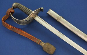 An antique Swiss M1875 Cavalry officers Sword with original knot by Wester & Co Solingen. Length 99cm. In very good condition. Price 475 euro.