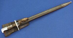 An Antique Swiss Model 1887 Sawback Musician's/bandsman Bayonet with leather frog. S.I.G. Neuhausen. SN1875, dated 1888. Originaly for Vetterli Rifle. Length 62,5cm. In very good condition. Price 425 euro.
