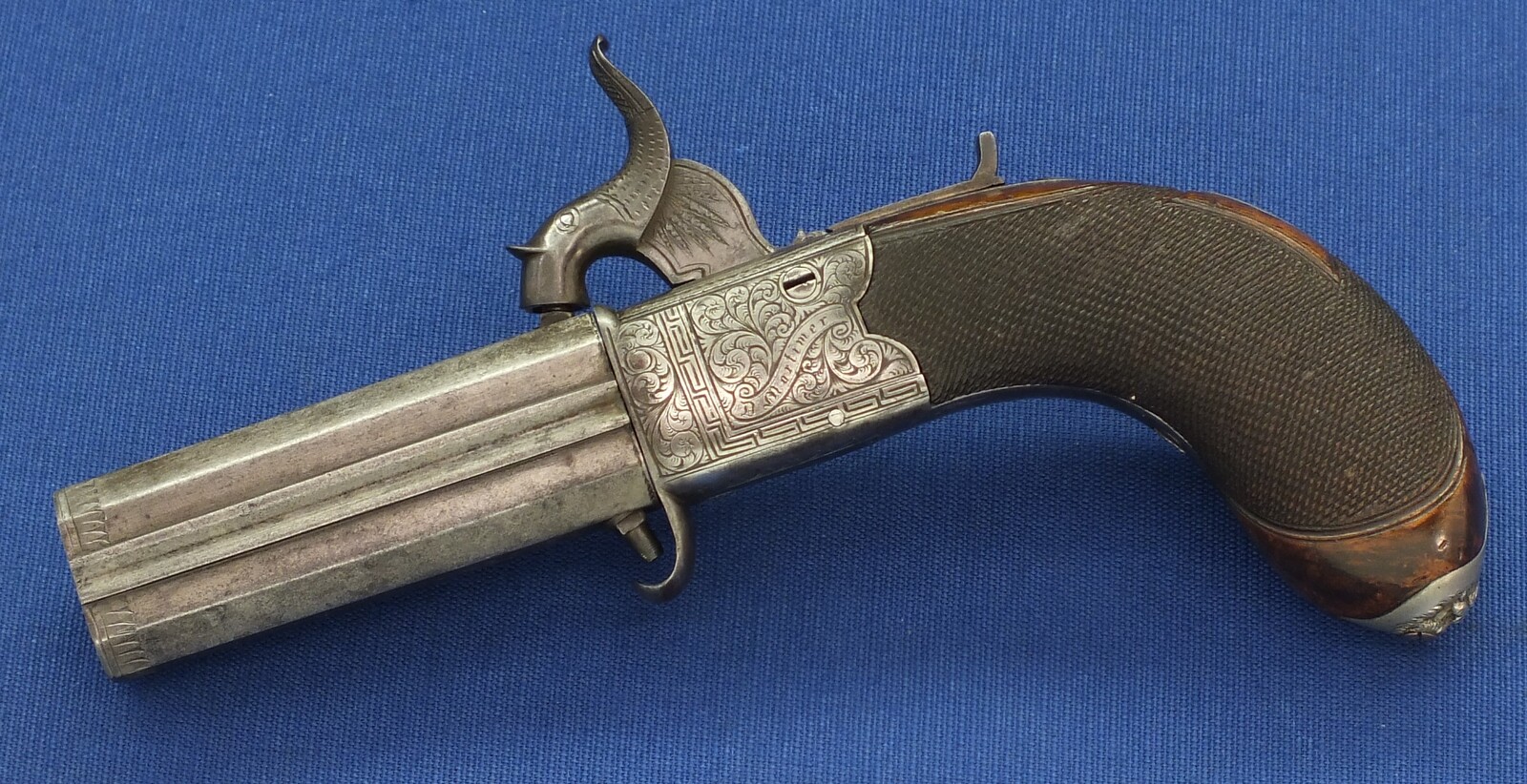 An English Percussion Wender pistol with thumbpiece safety catch by D.Mortimer London. Caliber 9,5mm. Length 19cm. In very good condition. Price 950 euro