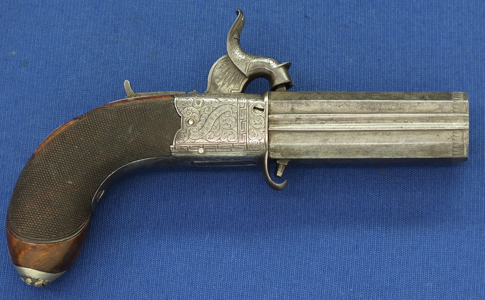 An English Percussion Wender pistol with thumbpiece safety catch by D.Mortimer London. Caliber 9,5mm. Length 19cm. In very good condition. Price 950 euro