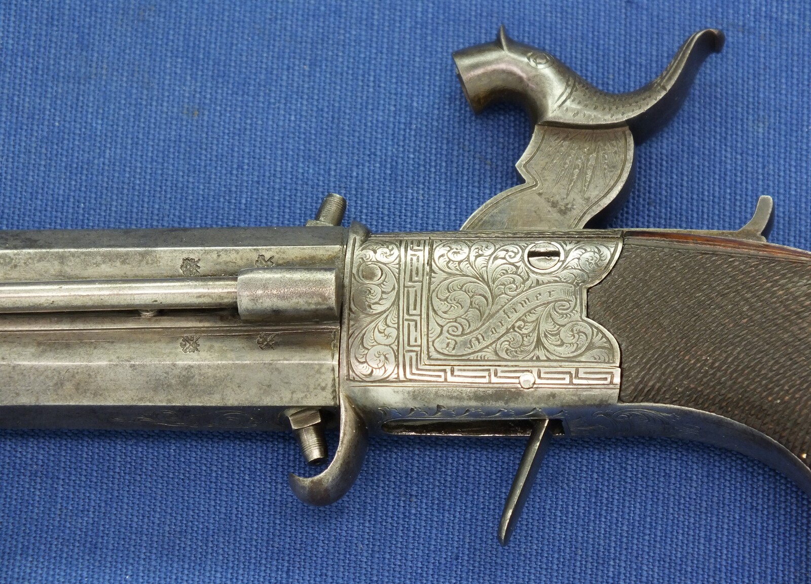 An English Percussion Wender pistol with thumbpiece safety catch by D.Mortimer London. Caliber 9,5mm. Length 19cm. In very good condition. Price 950 euro